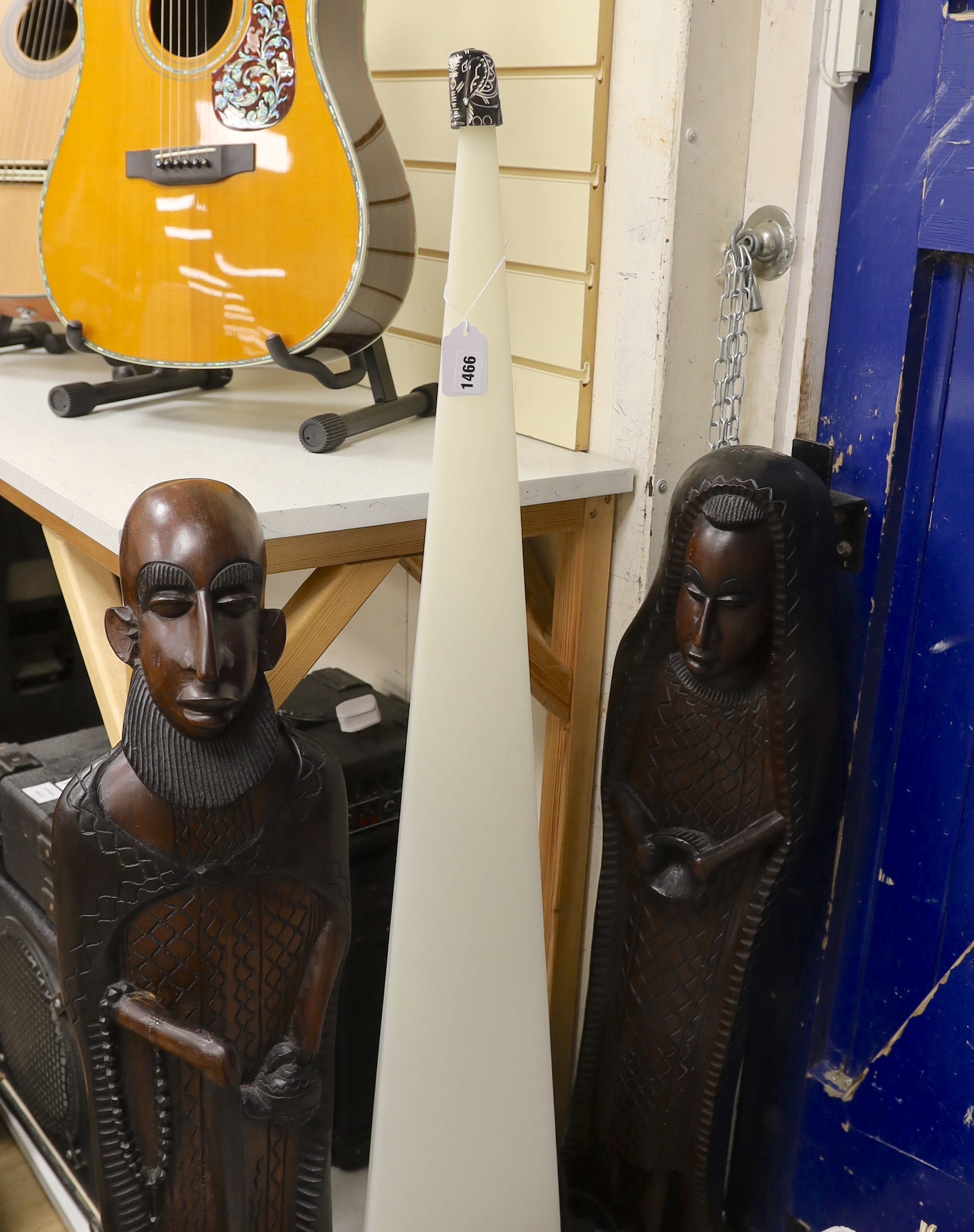 A pair of large African hardwood figural carvings and a Mathmos floor lamp